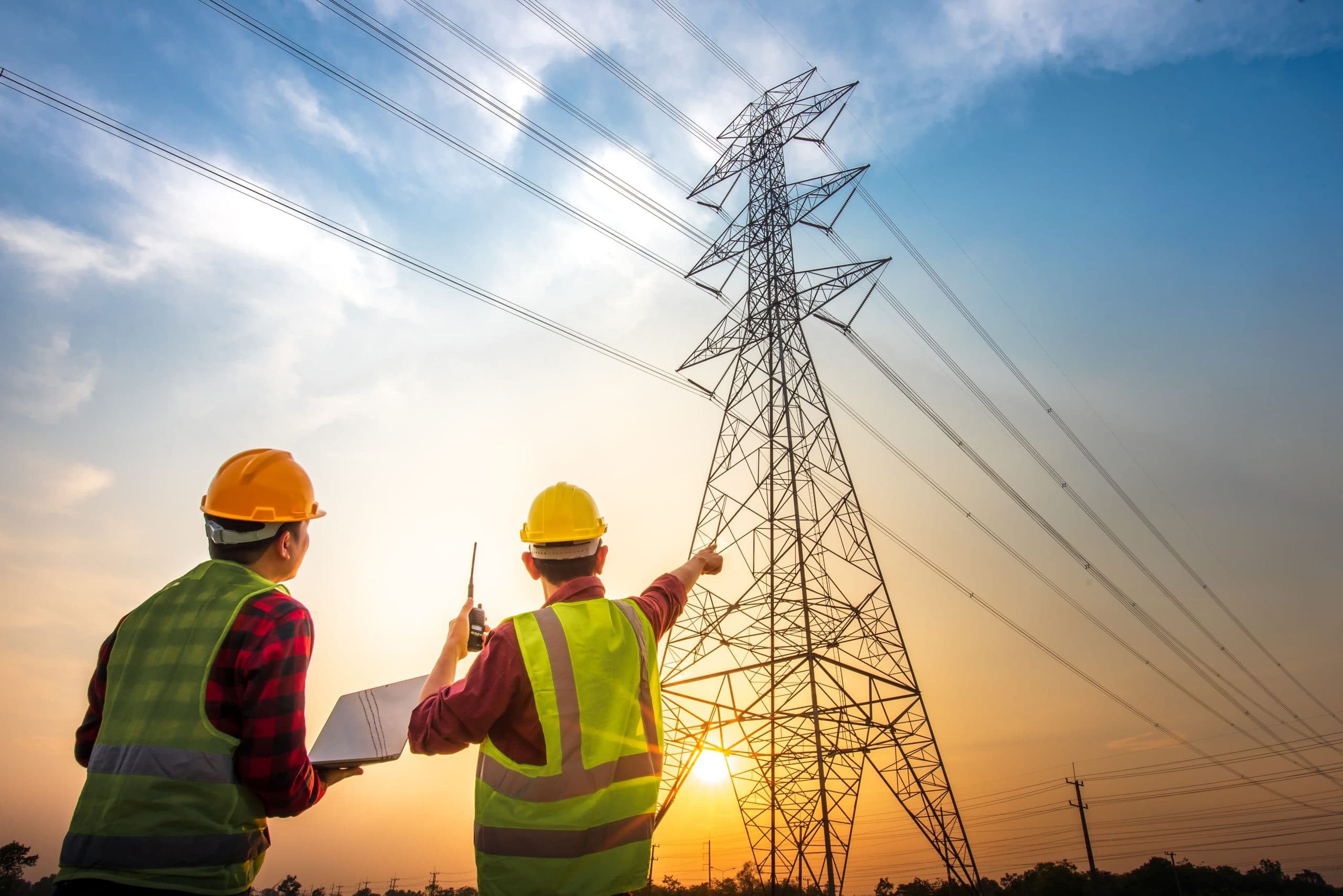 picture two electrical engineers checking electrical work using computer standing power station see planning work high voltage electrodes 2 1 scaled