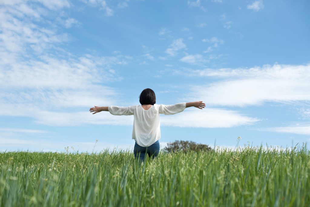 Woman in green field