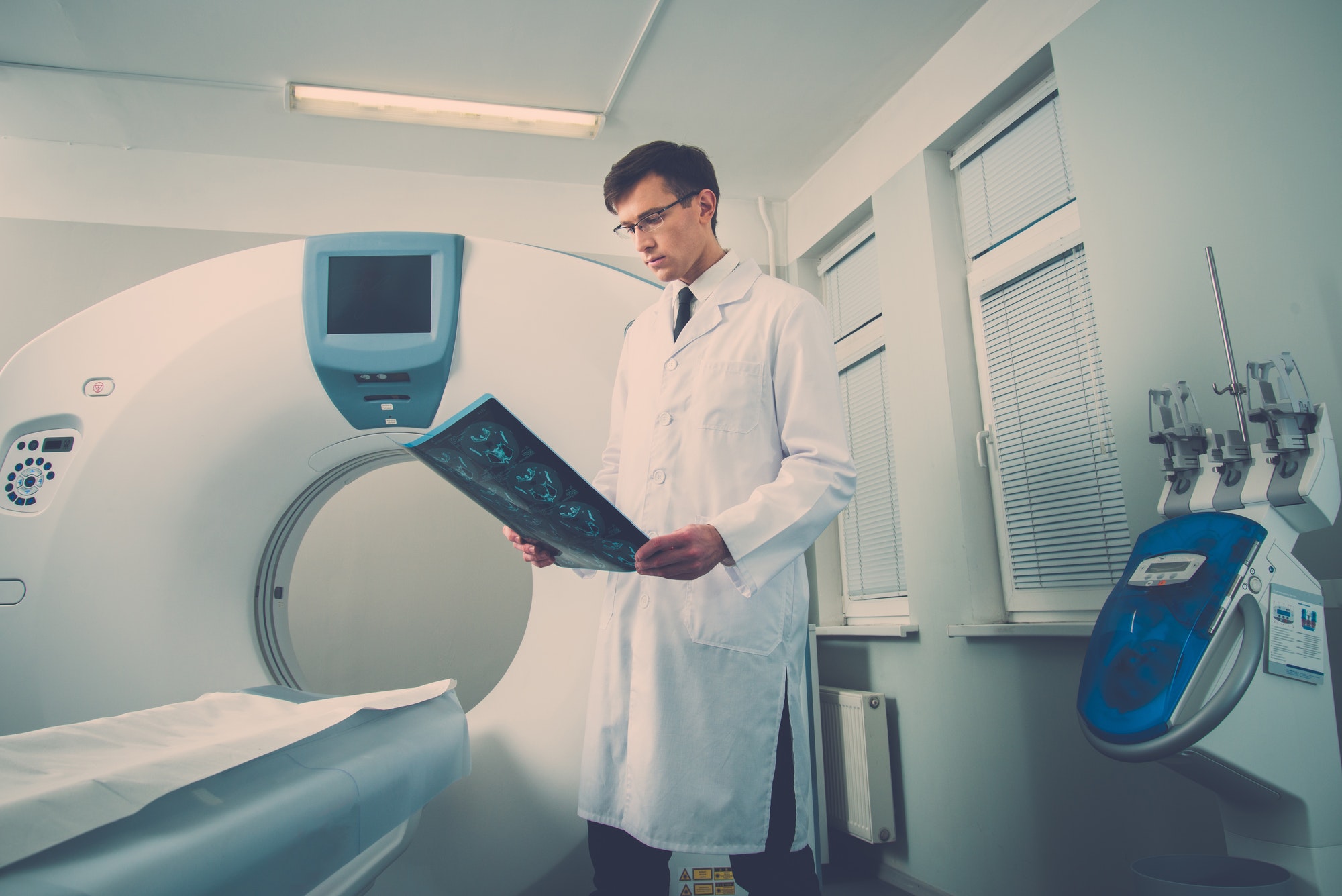 doctor looking at the computed tomography results